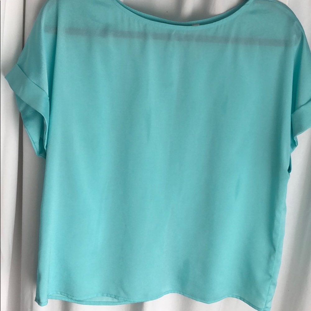 Light blue silky shirt with an open back !!